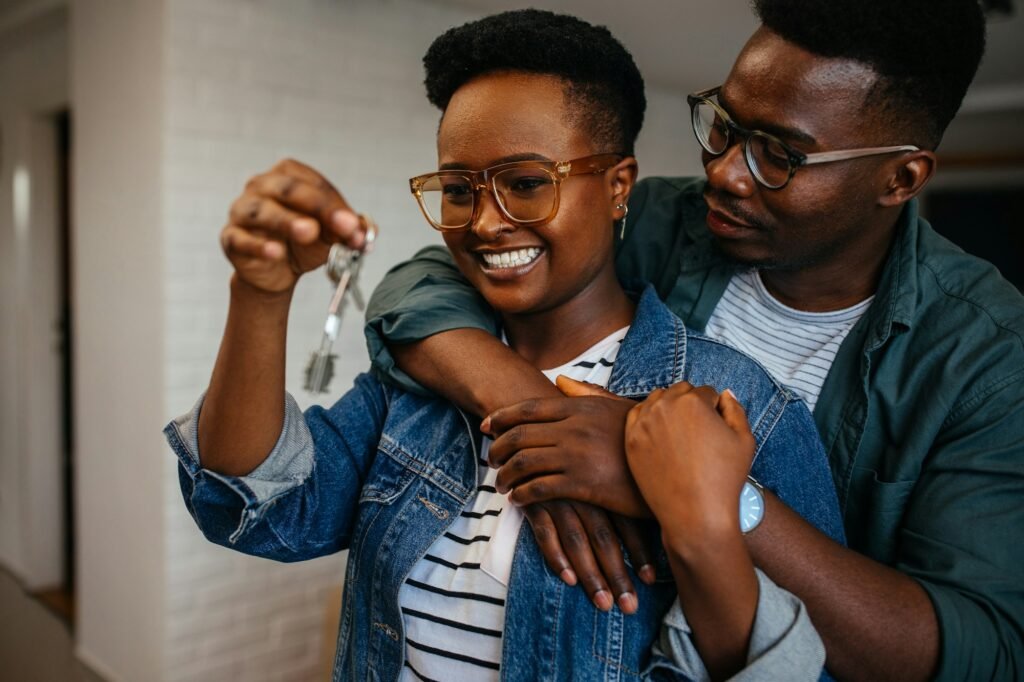 Couple holding the keys of their new house