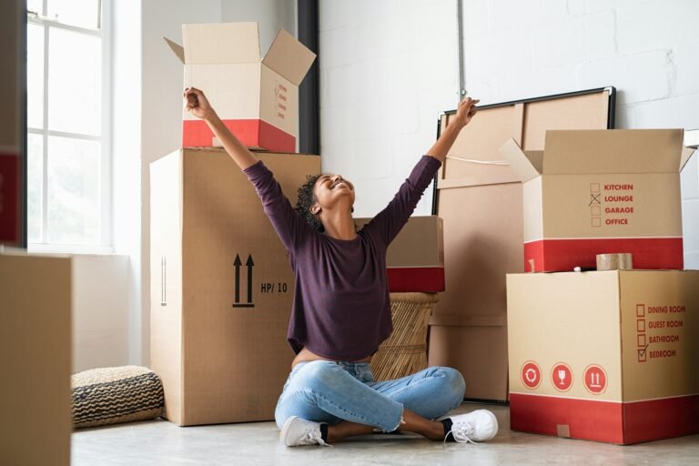 Excited young woman in new house